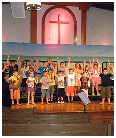 Children Singing and Dancing on Stage